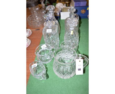Cut glassware, to include: four decanters and four cream jugs of various designs.