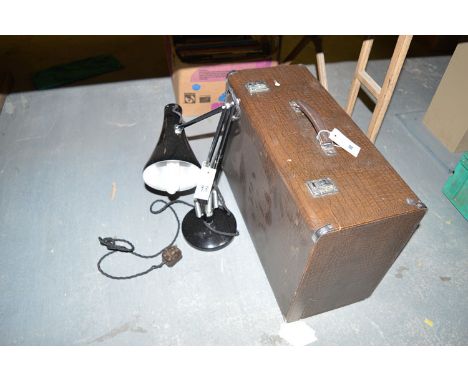 A modern portable Singer sewing machine, in imitation crocodile skin case; together with a black anglepoise lamp.