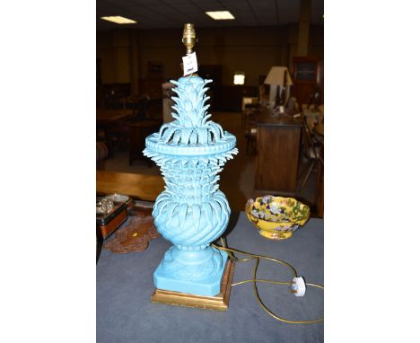 A large Victorian style ware table lamp of stylized pineapple form with blue glaze, on square plinth base with gold painted w