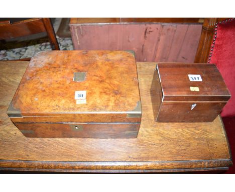 A 19th Century figured walnut brass bound writing slope opening to reveal a fitted interior (missing its inkwell); together w
