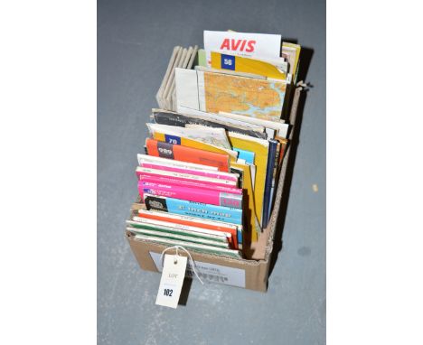 A collection of Ordnance Survey and other maps, in a box.