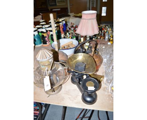 A cast iron skillet; a flat iron; copper kettle; copper lamp; cast iron kitchen balance and weights; a brass horn; wooden orn
