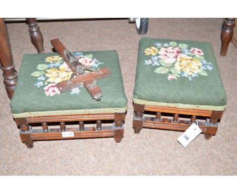 A pair of footstools with tapestry upholstered tops.