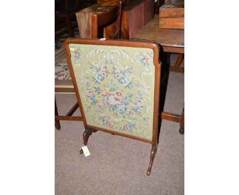 A needlework firescreen in mahogany frame.