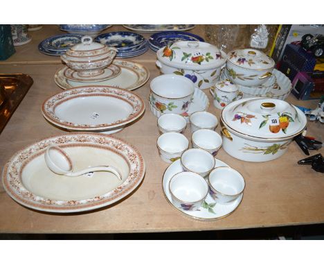 A collection of Royal Worcester 'Evesham' pattern oven-to--table ware, comprising: tureens, flan dishes, ramekins, etc; and a