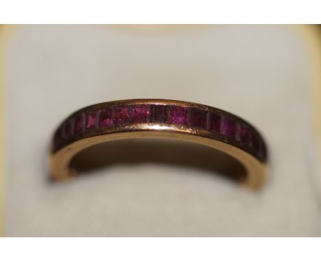 Yellow metal full eternity ring set with genuine rubies Size S 