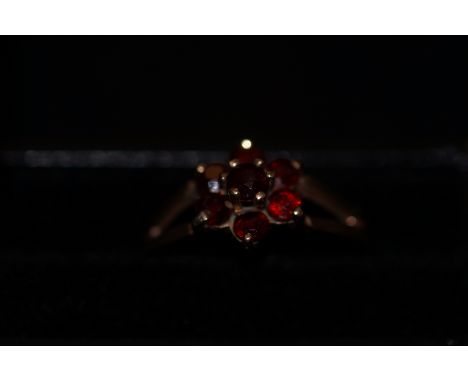 9ct Gold ring set with red stones