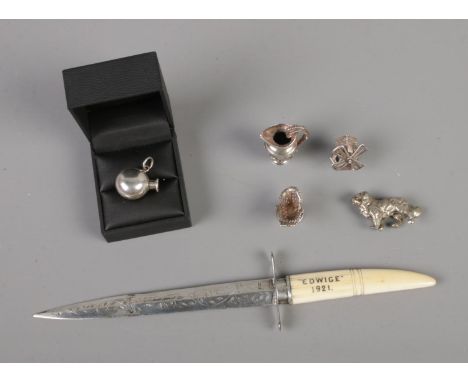 A silver bladed letter opener in the form of a dagger stamped Edwige 1921 to hilt (Assayed Birmingham 1890) along with severa