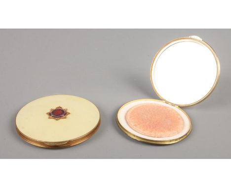 Two powder compacts bearing Royal Army Service Corps. badges, one produced by Stratton.  
