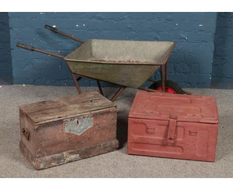 A galvanised metal wheelbarrow, together with a tin trunk dated 1944 and hinged wooden box.  