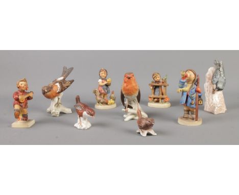 A collection of Goebel ceramic birds and figures, including 'Happiness' and 'Hear Ye, Hear Ye'.  Small chip to the end of the