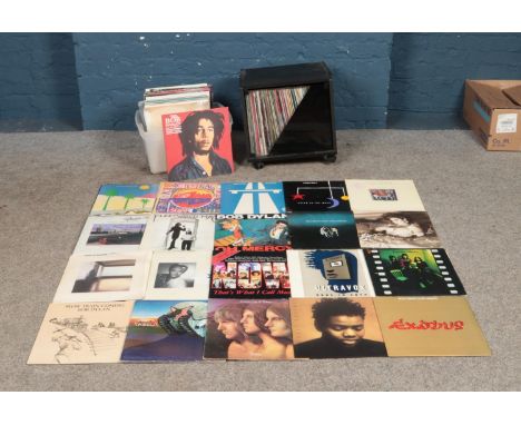 One box and one cabinet of records of mainly rock and pop to include The Cure, Kraftwerk, Paul Simon, Bob Dylan, Madonna and 