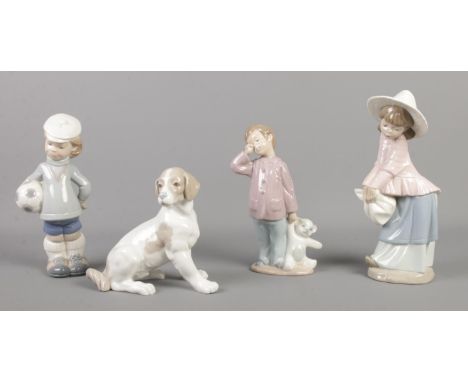 Four Lladro and Nao by Lladro ceramic figures, to incude boy with football and tired boy with bear.  