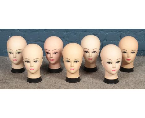A box of vintage mannequin display heads.  