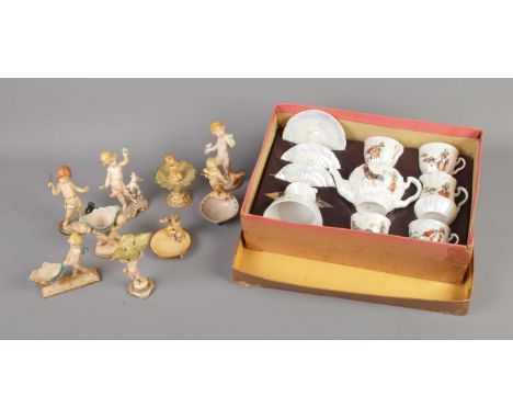 A collection of small Depose figures formed as cherubs along with child's lustre tea service.  