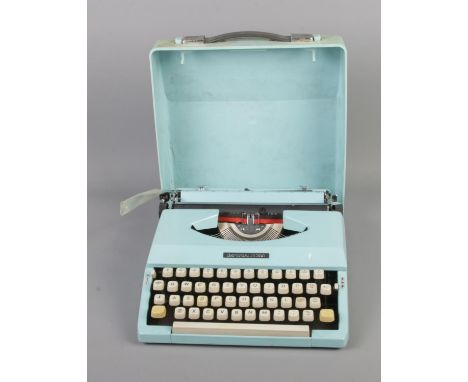 An Imperial 200 pale blue typewriter in case.  