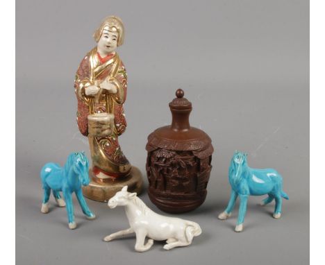 A small quantity of oriental items. Includes miniature ceramic horses, figure and a composite snuff bottle.  