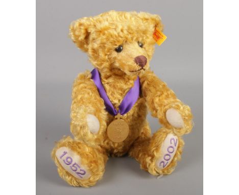 A Danbury Mint Golden Jubilee Steiff bear with medal.  