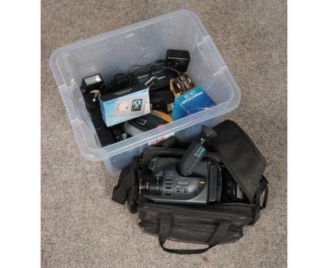 A box of photographic equipment. Includes Hitachi E24E video camera and various accessories.  