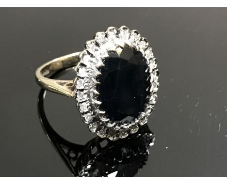 A 9ct gold CZ and synthetic sapphire dress ring, size M
