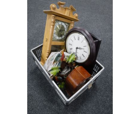 A box containing two quartz wall clocks, a cuckoo clock, Tempus Fugit mantel clock