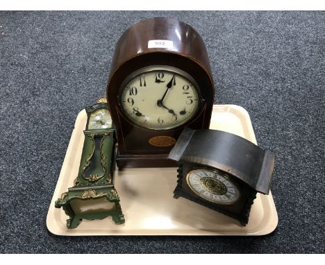 An Edwardian inlaid mahogany mantel clock, an oak mantel clock and a miniature longcase clock