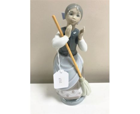 A Lladro figurine : A Clean Sweep, model 5025, height 24 cm, boxed. 