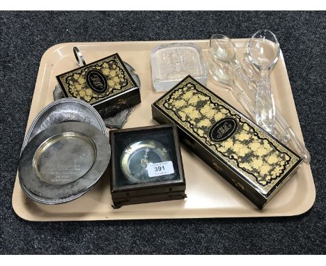 An Indian white metal leaf dish, two items of silver plate, two lacquered trinket boxes, a boxed compass, a glass paperweight