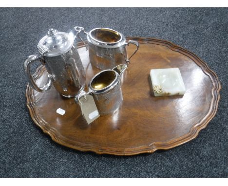 A mahogany scalloped edge serving tray together with a three-piece Walker &amp; Hall plated tea service and a onyx ashtray