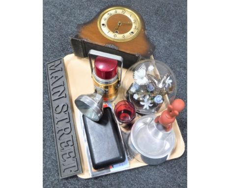 A tray of walnut cased mantel clock, vintage Pifco lamp, two cast iron signs - Canadian Pacific and Main Street, Alessi nut c