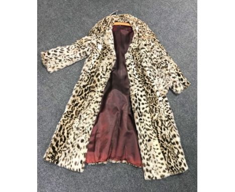 A good quality vintage Ocelot fur coat, circa 1930's, together with a matching hat  CONDITION REPORT: Pre-1947 and therefore 