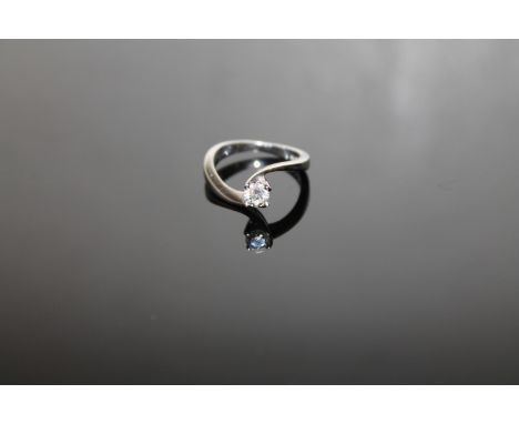 An 18ct white gold diamond solitaire ring, approximately 0.3ct, size J.