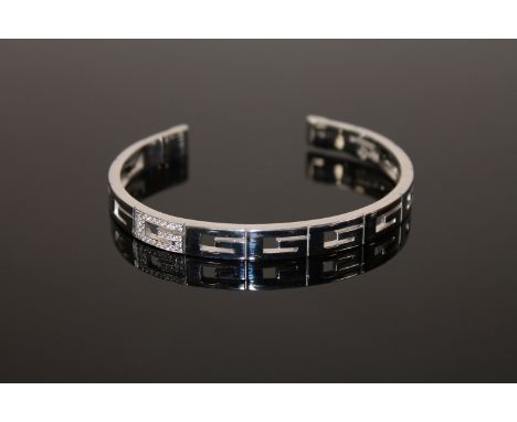 An 18ct gold diamond set bangle by Gucci, 28.2g (Cost £2,800 new) 