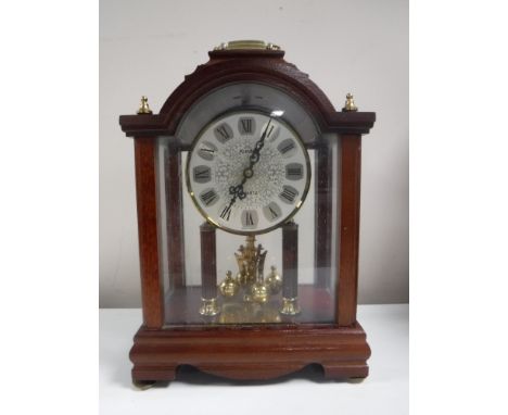 A Kundo quartz mantel clock