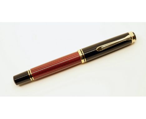 Pelikan M600 red stripe fountain pen with box and papers. A classic Pelikan pen with medium two-tone 14c 585 nib. Overall nea