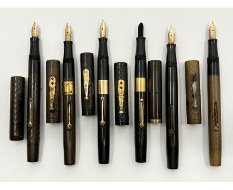 Waterman Ideal 52 model lever fill fountain pens in smooth and chased black hard rubber (6). The lot consists of four pens wi