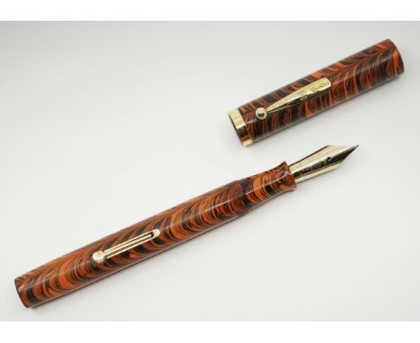 Waterman Ideal model 58 lever fill Red Ripple fountain pen. The Ripple pattern appears to have first launched in the Waterman