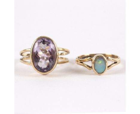 An opal set dress ring, to a 9ct gold mount, size L and an amethyst 9ct gold set dress ring, size M, approximately 6.5gm