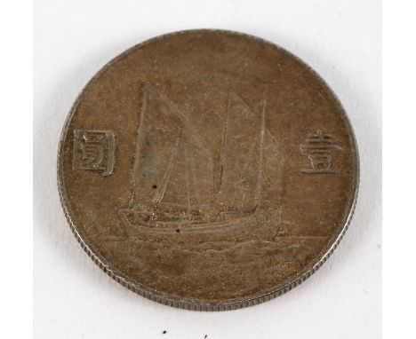 A Chinese silver dollar, Republic, Sun Yat-Sen, decorated with a junk