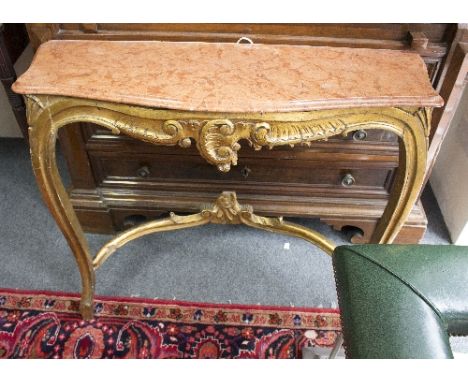 A giltwood console table, late 19th/early 20th Century, with C scroll and foliate central motif with serpentine marble top, 9