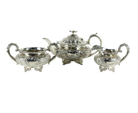 A George IV silver three-piece tea set, Charles Fox, London 1824/25, each piece with leaf capped handles, foliate decoration 