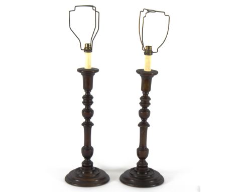 A pair of turned wood lamp bases, 44cm high excluding fittings