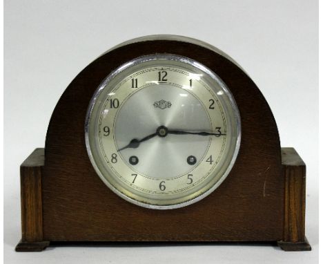 An Art Deco style mantel clock, the silvered dial signed Garrard and with Arabic numerals, 30cm wide   Condition Report:  In 