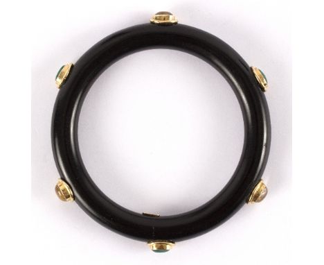 An onyx bangle set with oval cabochons and marked 585 to a small oval plaque