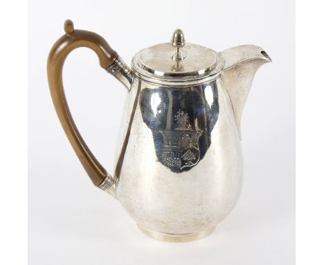 A George III silver coffee pot, London 1799, of tapering baluster form, engraved an armorial, with acorn finial to cover, 20c