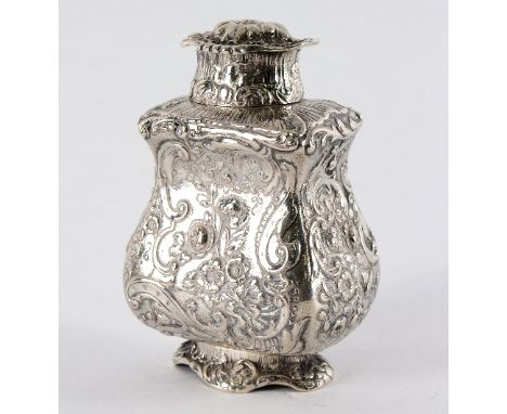 A Continental white metal tea caddy, probably Hanau, profusely decorated flowers and scrolls, 12cm high, approximately 230gm