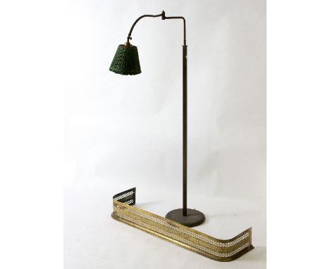 An adjustable reading lamp and a brass fire curb