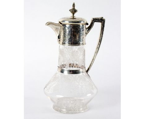 A Victorian silver mounted claret jug, Charles Boyton, London 1880, the hinged cover with finial, the jug with vine leaf deco