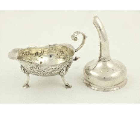 A George III small silver helmet shaped Gravy Boat, London c. 1799, chased with floral and leaf scrolls on three shell capped