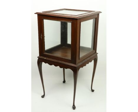 A mahogany Vitrine or Curio Cabinet, with five glazed panels on the door, the moulded top on four cabriole legs on pad feet, 